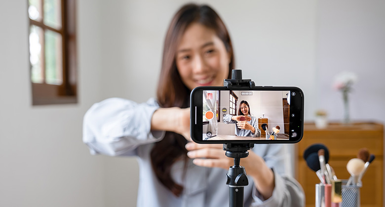 Women recording video on phone